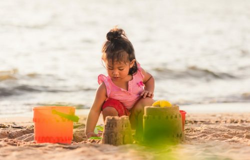 Happy,Fun,Asian,Child,Cute,Little,Girl,Playing,Sand,With