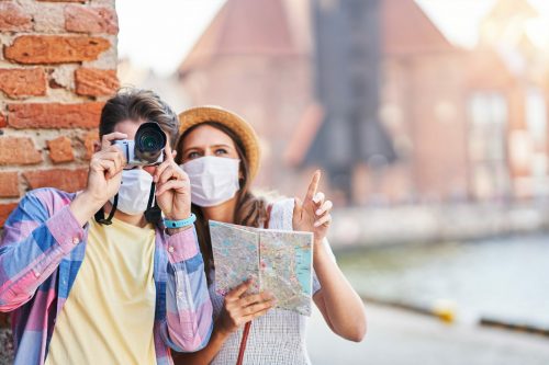 Adult,Tourists,In,Masks,Sightseeing,Gdansk,Poland