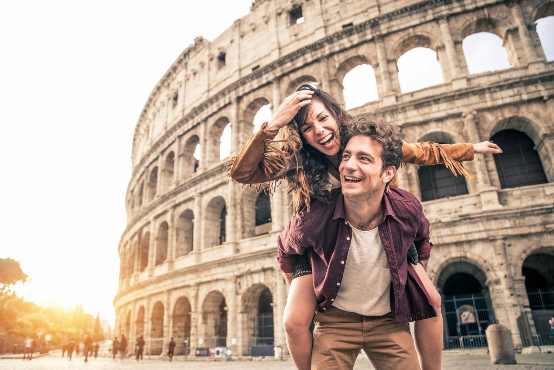 Young,Couple,At,The,Colosseum,,Rome, ,Happy,Tourists,Visiting